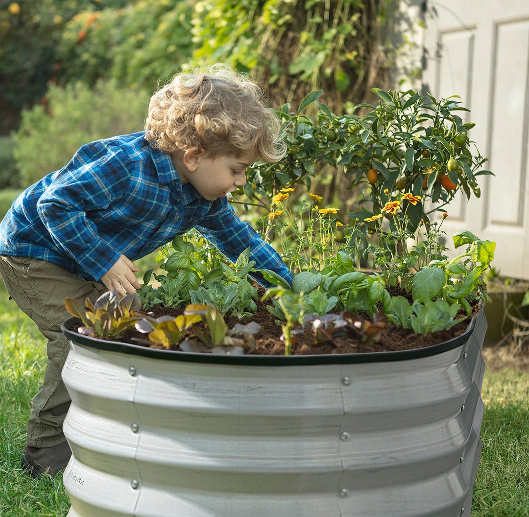 planters for outdoor plants with a child planting