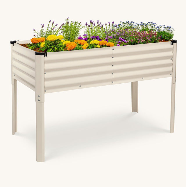 metal white elevated garden bed with flowers