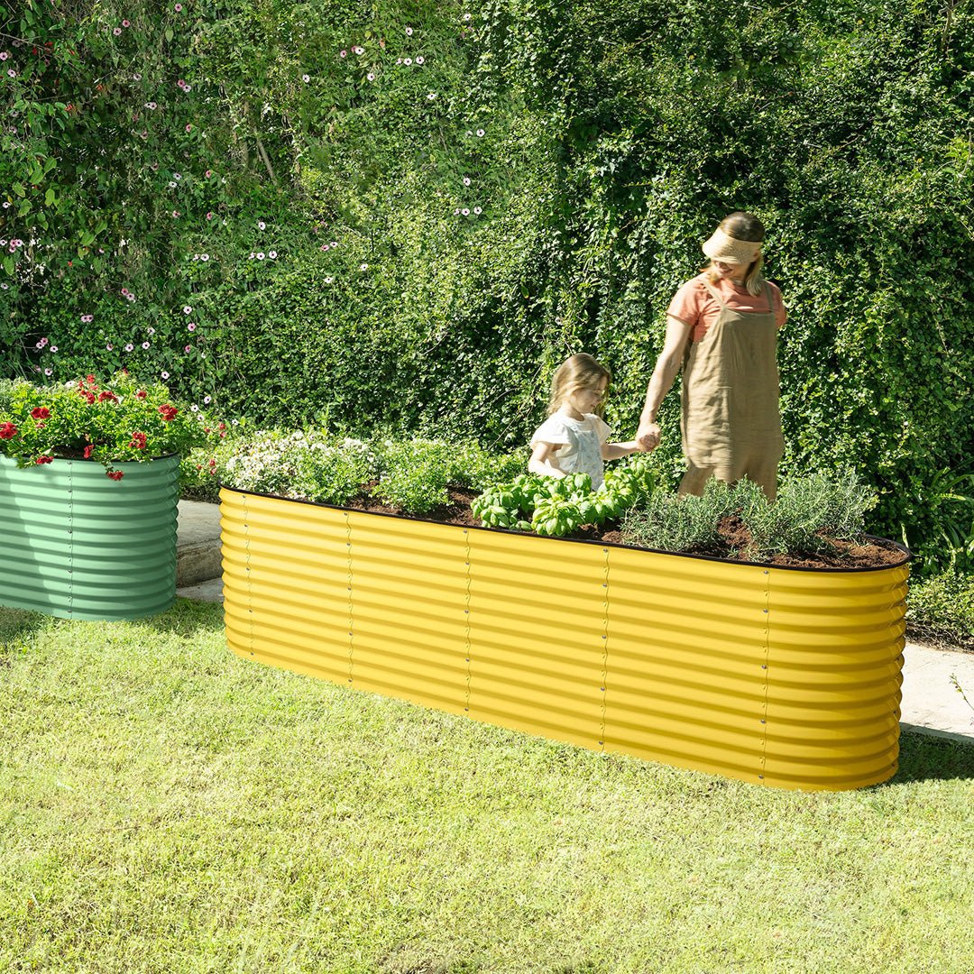 mother and child next to a yellow metal raised garden bed