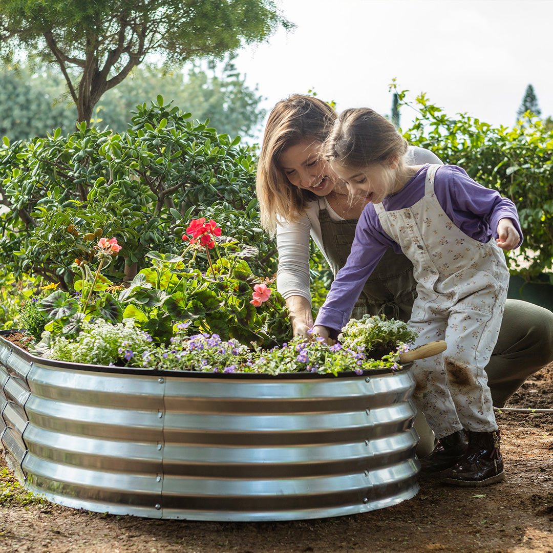 metal garden bed with mother and child gardening