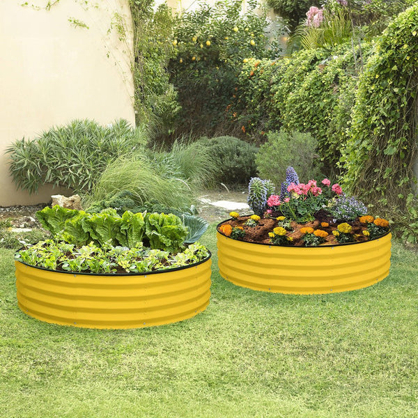 yellow galvanized raised garden bed on grass with plants