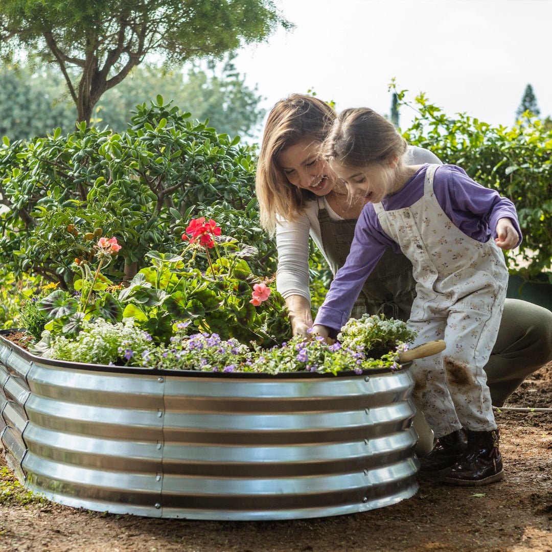 metal planter with mother and child