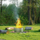 galvanized round planter that is used as a fire ring
