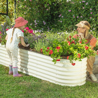 mother and child next to a galvanized steel raised garden bed