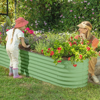 mother and child next to a galvanized steel raised garden bed