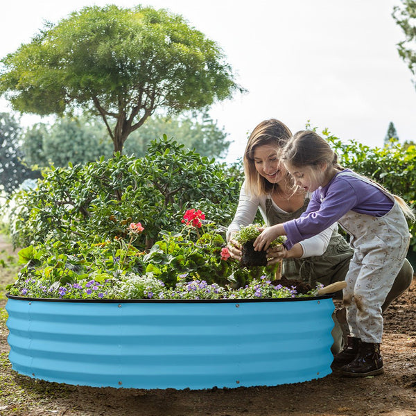 galvanized round planter with mother and child planting