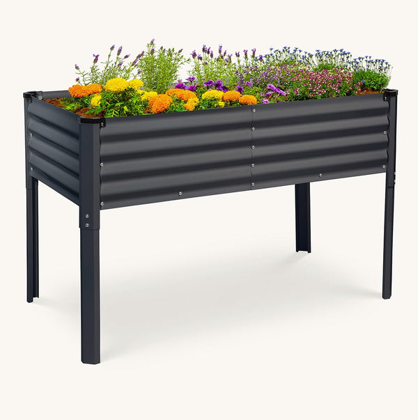 raised garden bed with legs with flowers inside
