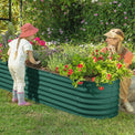 mother and child in the garden with a planters for outdoor plants