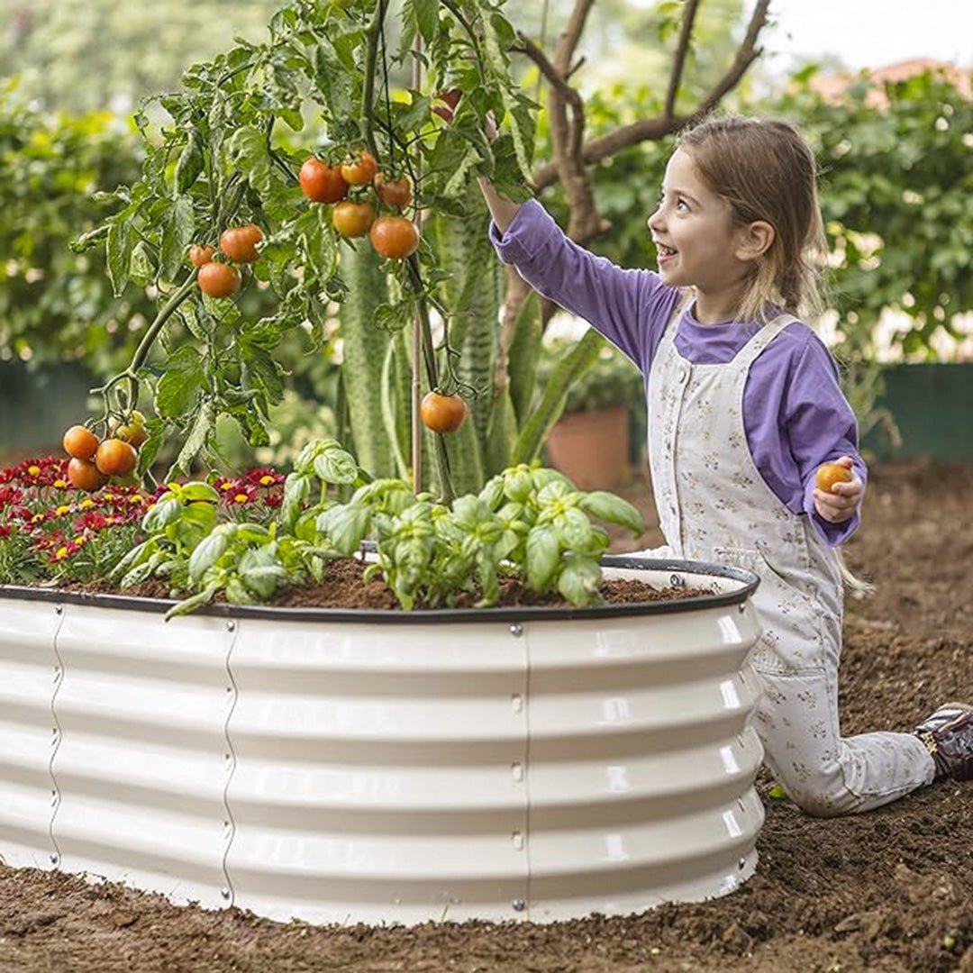 child planting with a galvanized raised garden bed 6x3x1