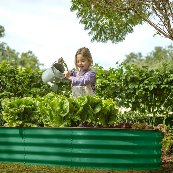 child planting with a planter boxes outdoor