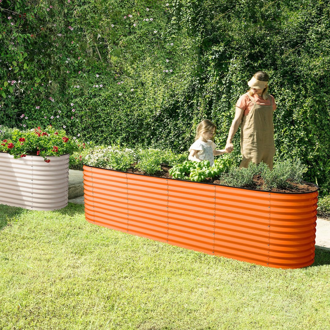 mother and child next to a metal raised garden bed