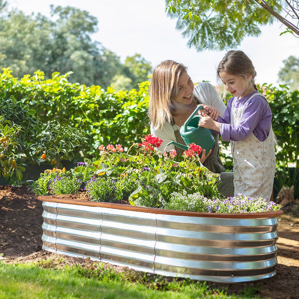 mother and child with garden boxes outdoor raised