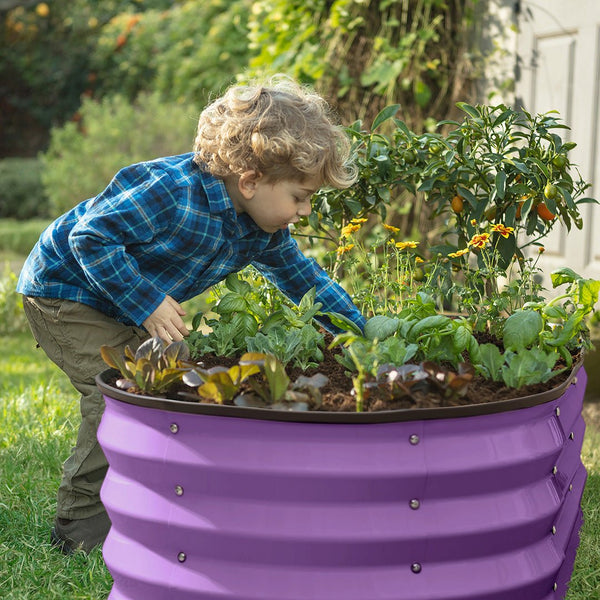 elevated garden bed with child planting