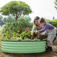 mother and child planting with metal raised garden bed